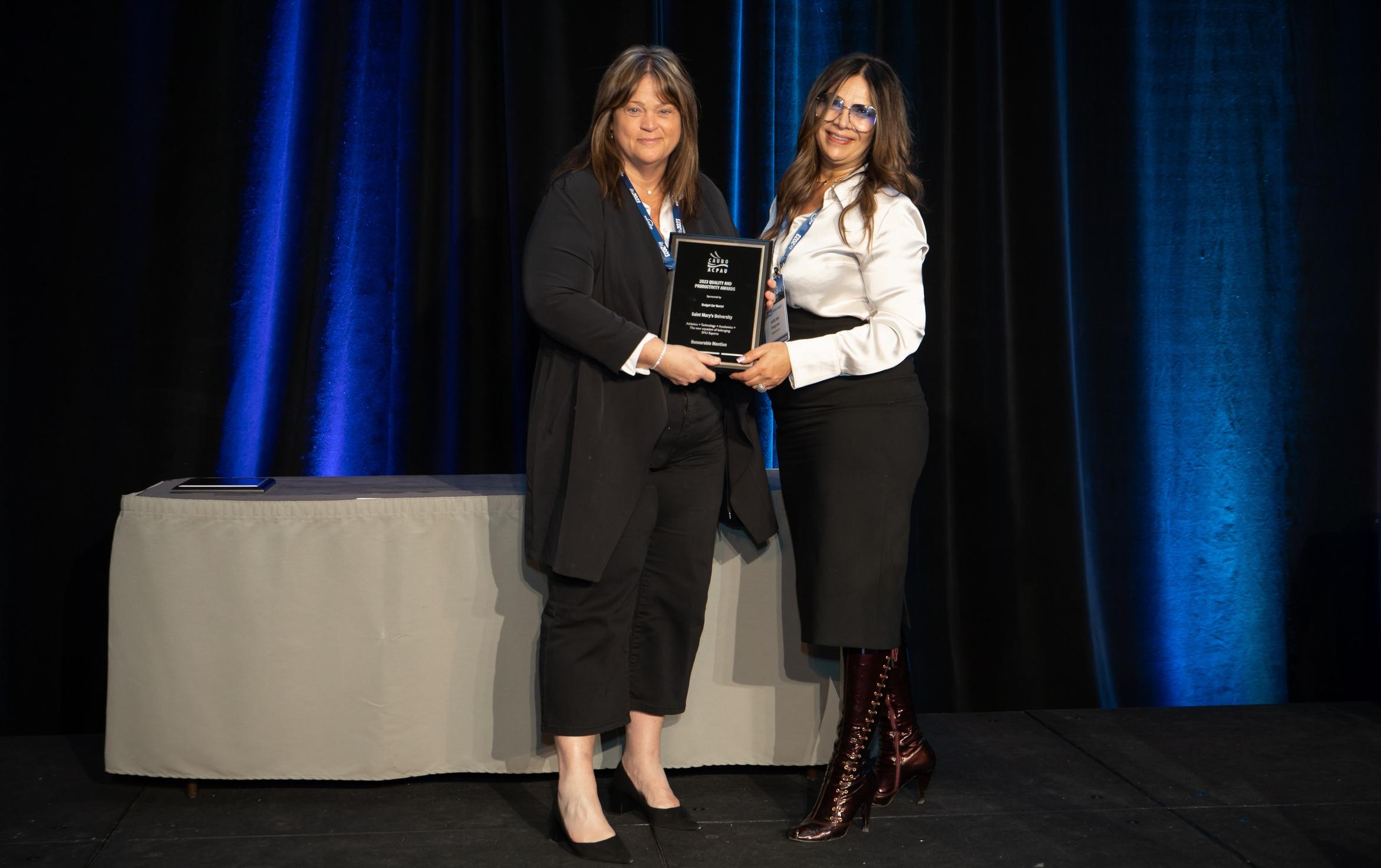 Michelle Benoit, Saint Mary's University Vice-President, Finance and Administration, accepts the 2023 CAUBO Quality and Productivity Award on behalf of the Huskies Esports project team at the CAUBO Conference in Toronto. (Photo courtesy: CAUBO)