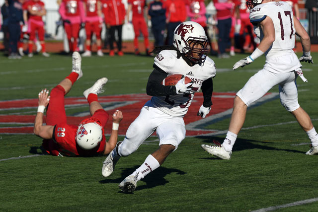 Axemen clinch first with 33-23 win over Huskies
