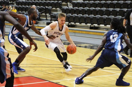 Huskies top Capers 79-60 in game 2 of Eric Garland Tournament