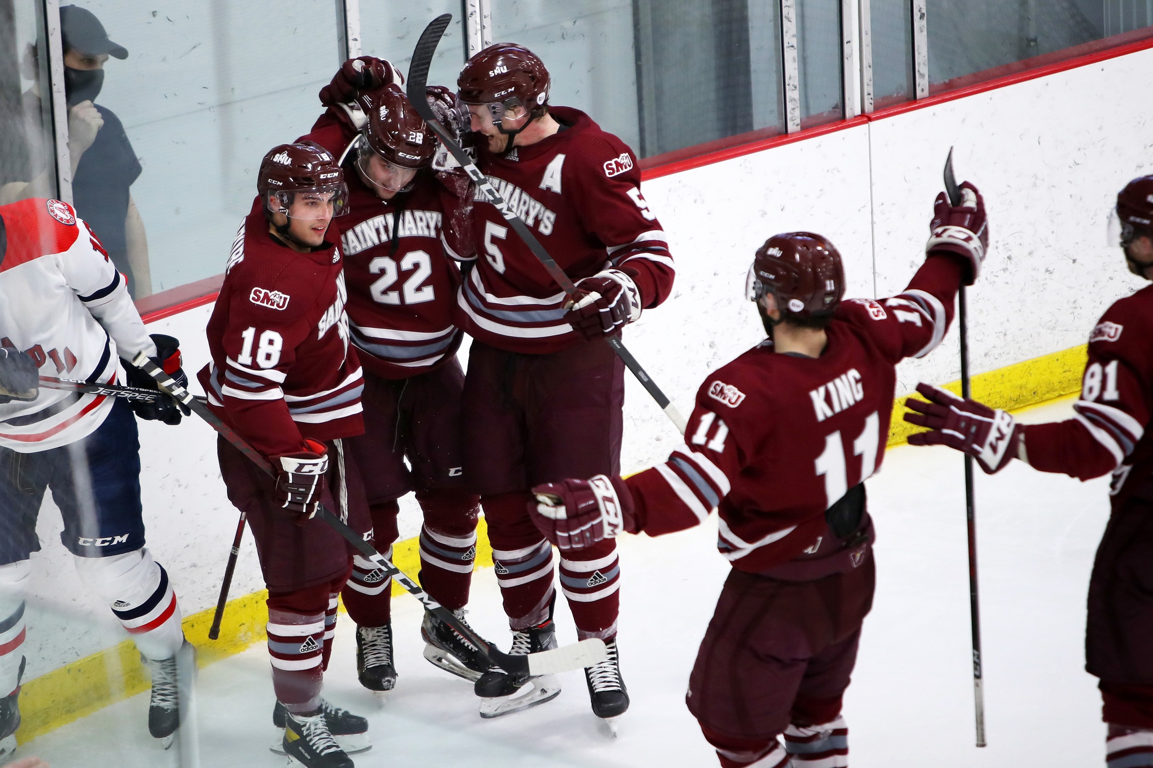 Huskies forward Ben Higgins (#22) celebrates with teammates after scoring his first career AUS goal in a 2-0 win over Acadia on March 2, 2022. (Photo by Nick Pearce / SMU Huskies Athletics)
